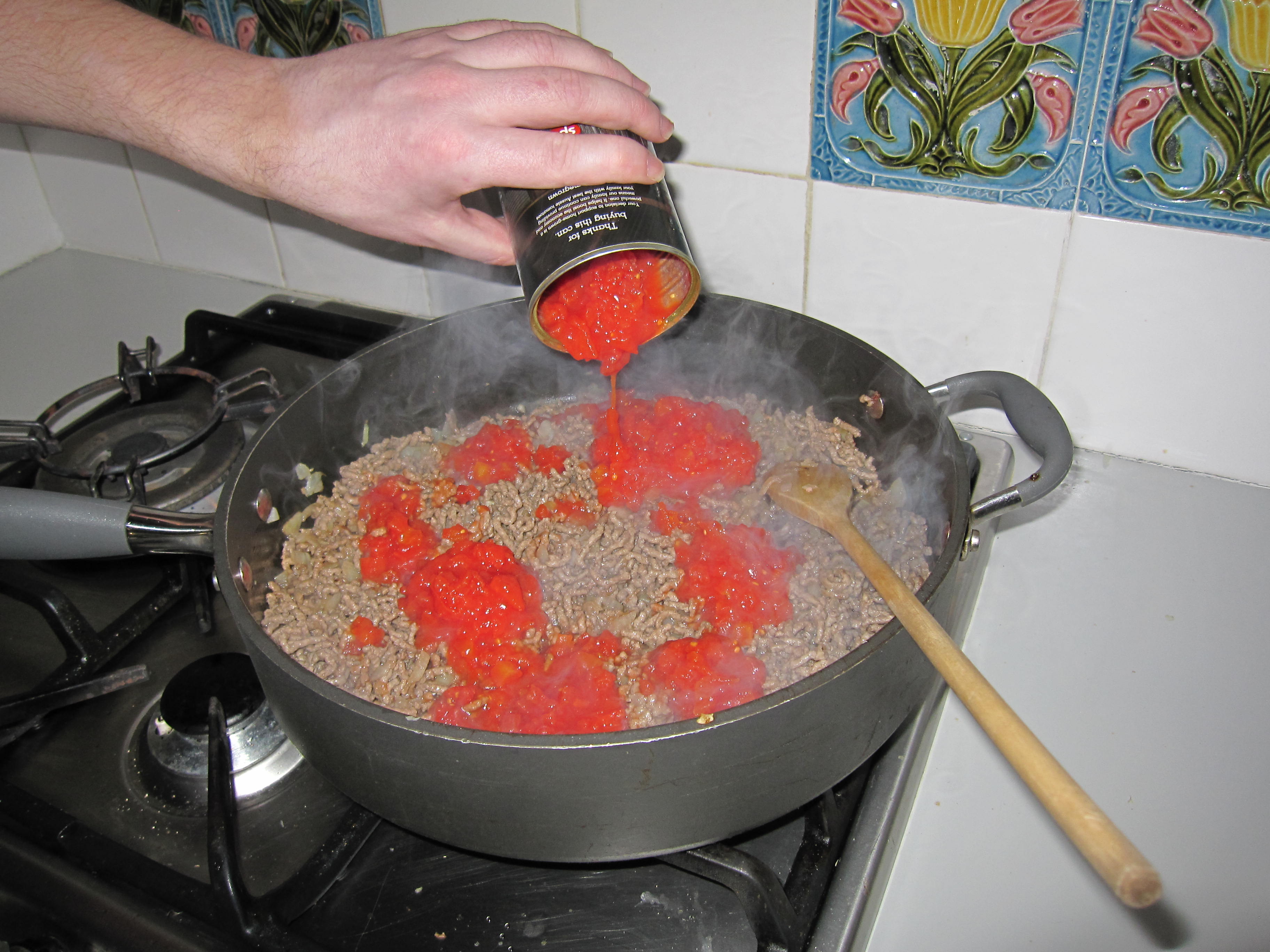 Pour crushed tomatoes